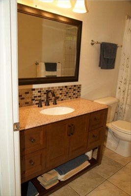 6701 Puupilo Road, Unit A Kapaa, HI 96746 - Photo 7 of 7 a bathroom with a sink and a mirror
