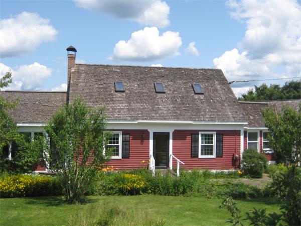 1452 Hawley Road Ashfield, MA 01330 - Photo 1 of 24 a front view of a house with garden