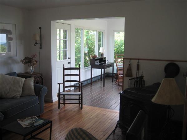 1452 Hawley Road Ashfield, MA 01330 - Photo 16 of 24 a living room with furniture and a wooden floor