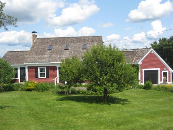 1452 Hawley Road Ashfield, MA 01330 - Photo 2 of 24 a front view of a house with a garden