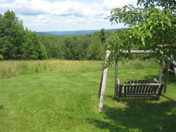 1452 Hawley Road Ashfield, MA 01330 - Photo 5 of 24 a view of a garden with a lake