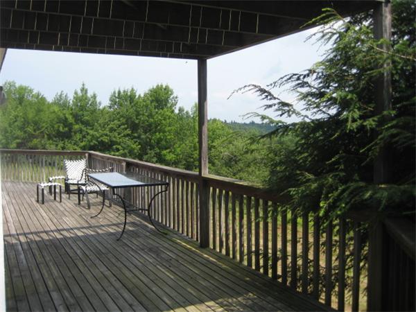 1452 Hawley Road Ashfield, MA 01330 - Photo 8 of 24 a view of balcony with wooden floor and outdoor seating