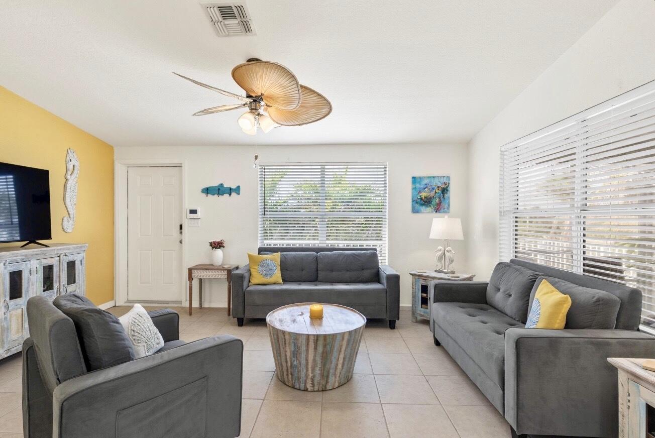 157 Mars Lane Key West, FL 33040 - Photo 9 of 41 a living room with furniture and a large window