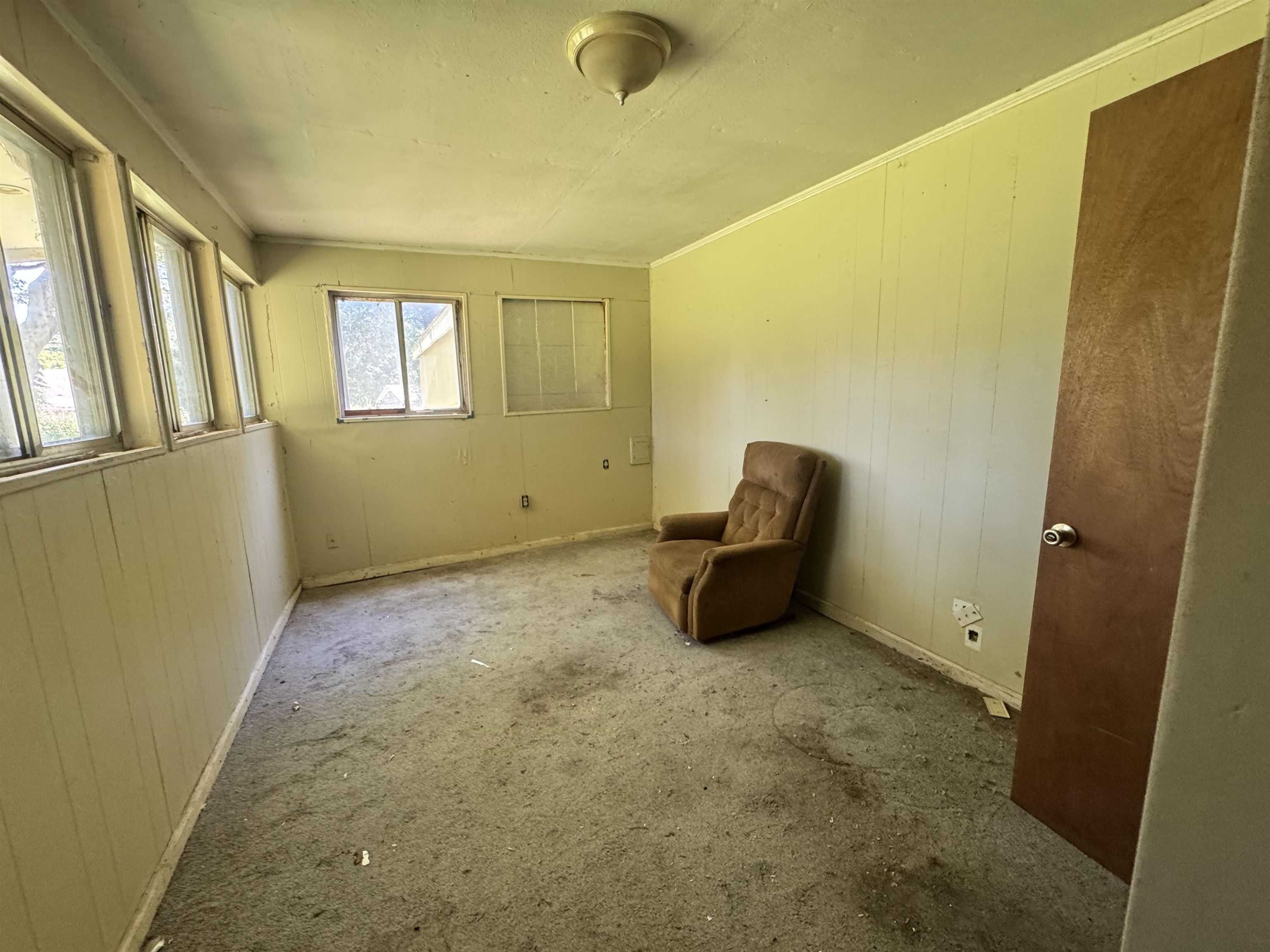4712 Drummonds Road Drummonds, TN 38023 - Photo 24 of 38 Interior room featuring multiple windows and paneled walls