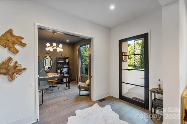 a view of a livingroom with workspace and a window