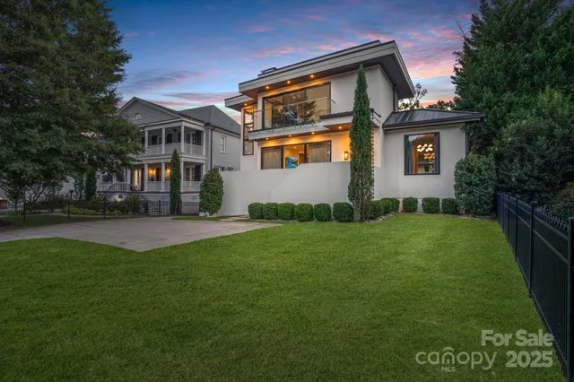 a front view of house with yard and trees