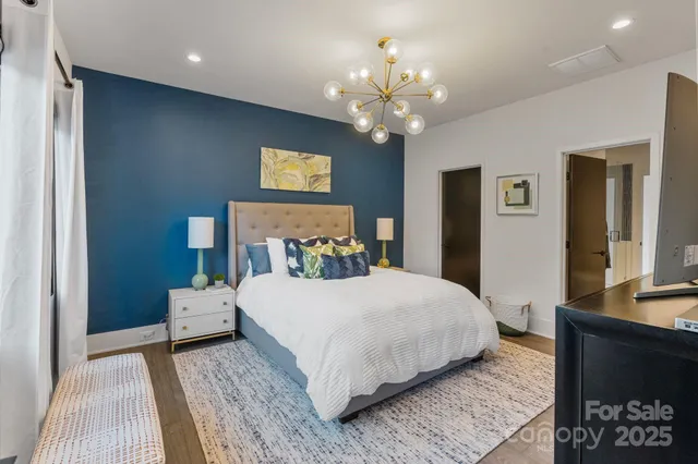 a bathroom with a double vanity sink toilet and shower