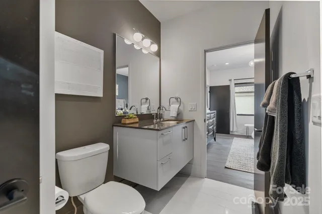 a view of a livingroom with furniture window and wooden floor