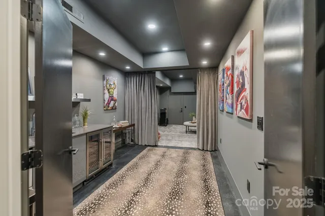 a living room with furniture and a glass table