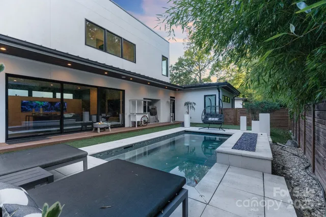a view of a house with pool table and chairs