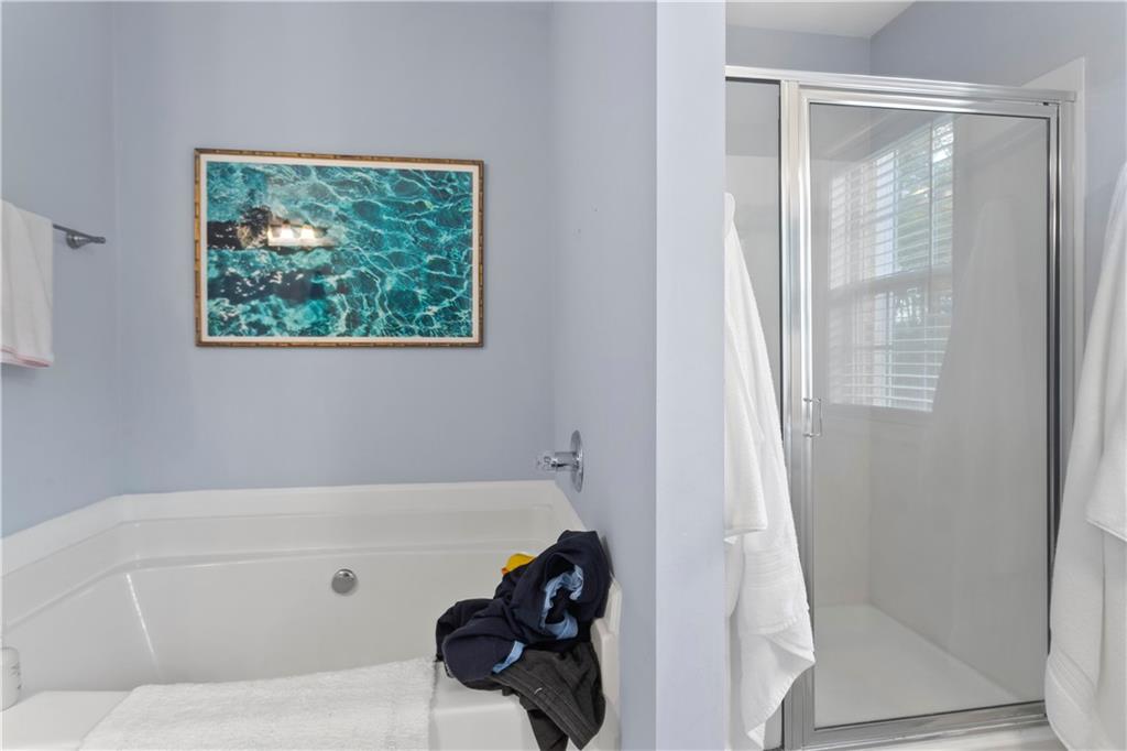 2924 Wintercrest Way Atlanta, GA 30360 - Photo 17 of 36 a bathroom with a tub and a shower