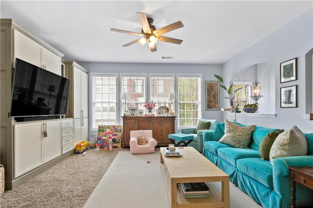 2924 Wintercrest Way Atlanta, GA 30360 - Photo 2 of 36 a living room with furniture and a flat screen tv