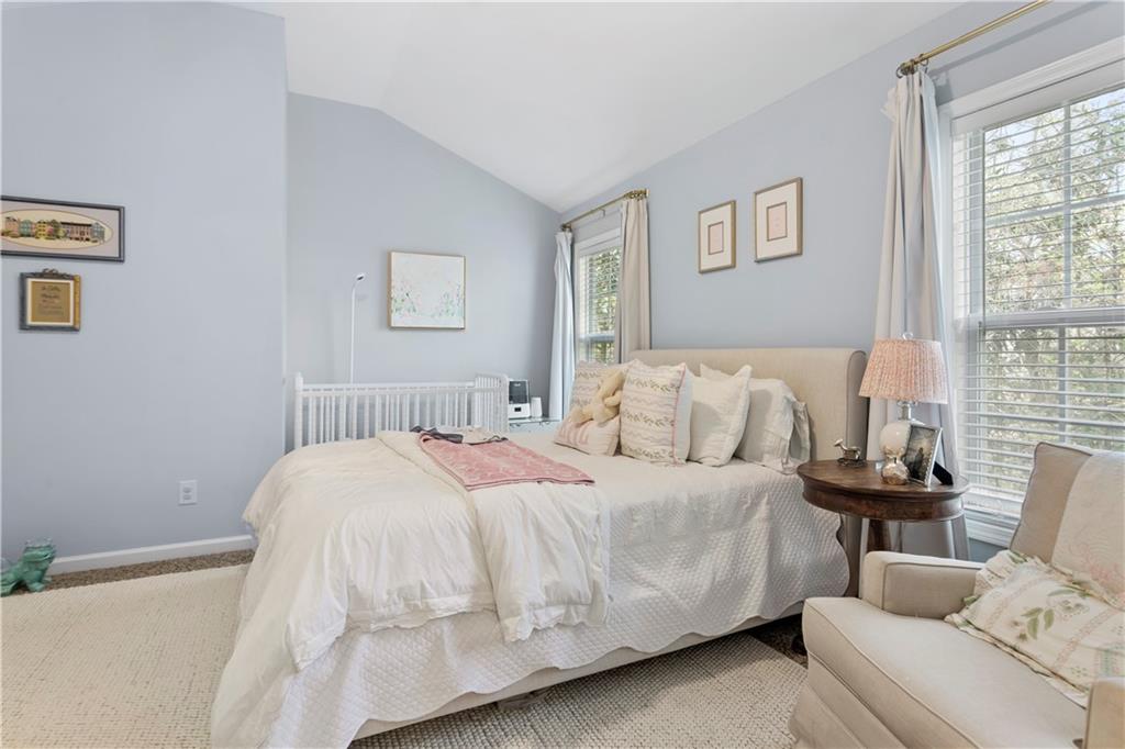 2924 Wintercrest Way Atlanta, GA 30360 - Photo 21 of 36 a bedroom with a bed and a couch