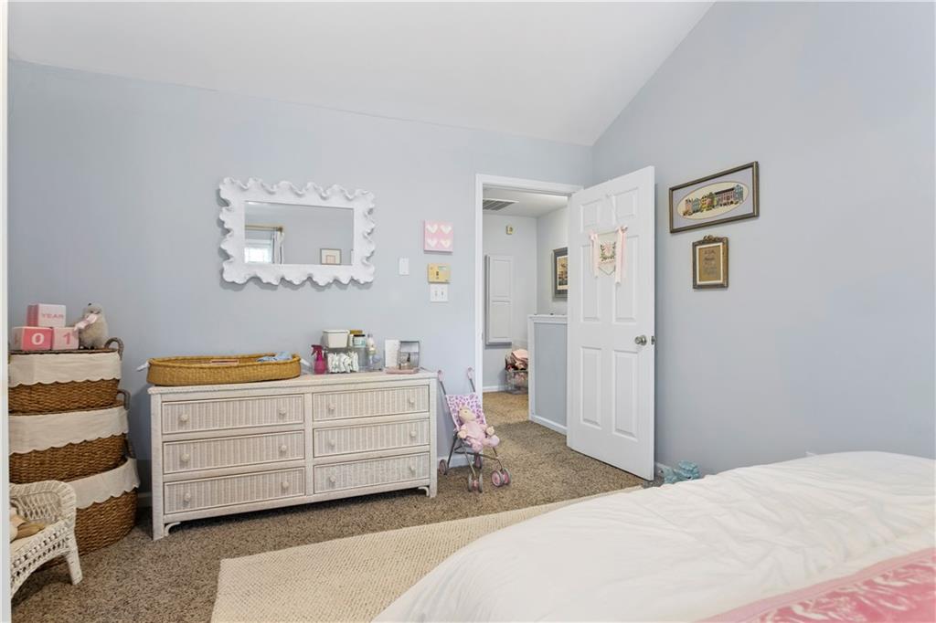 2924 Wintercrest Way Atlanta, GA 30360 - Photo 22 of 36 a bedroom with a bed and a dresser