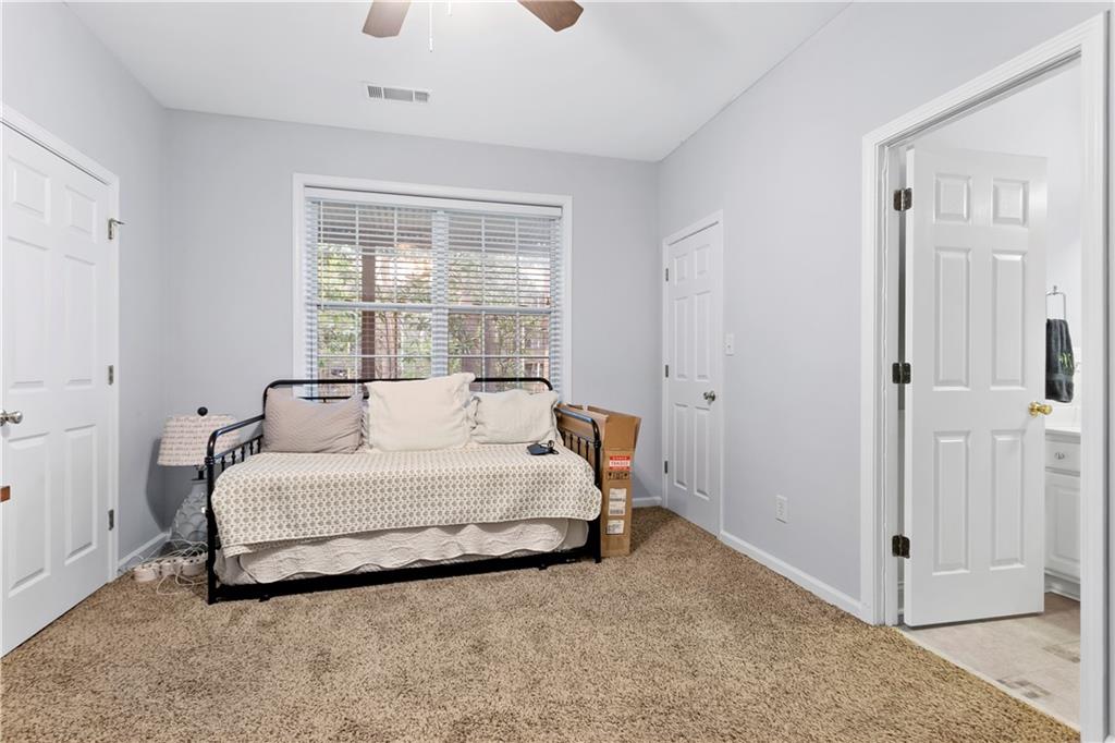 2924 Wintercrest Way Atlanta, GA 30360 - Photo 24 of 36 a spacious bedroom with a bed and a window