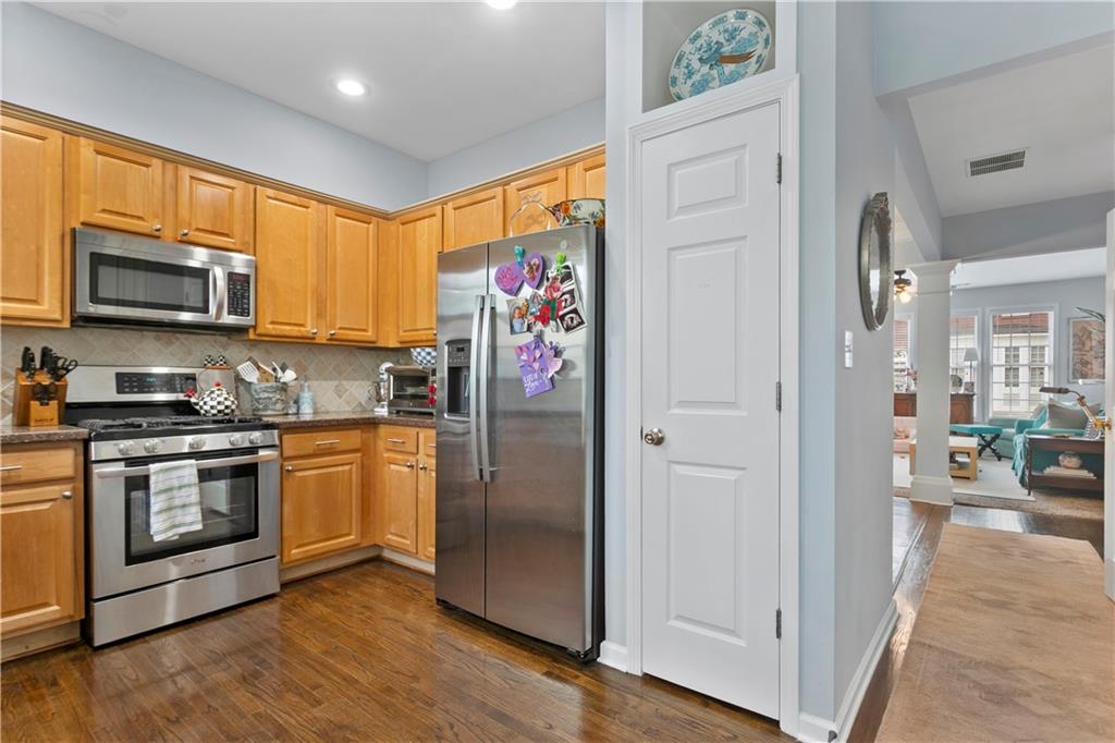 2924 Wintercrest Way Atlanta, GA 30360 - Photo 10 of 36 a kitchen with stainless steel appliances granite countertop a refrigerator stove and sink