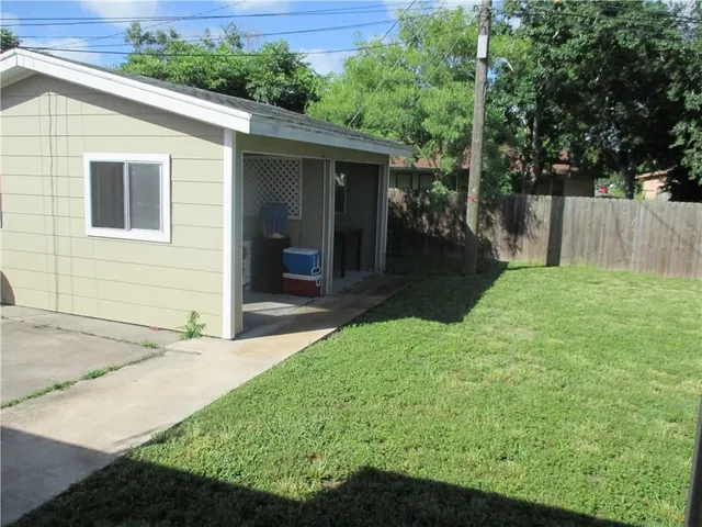 a view of backyard with green space