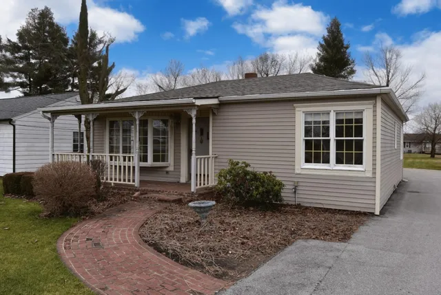a front view of a house with garden