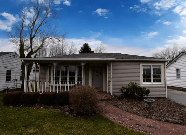 a view of backyard with a garden and plants