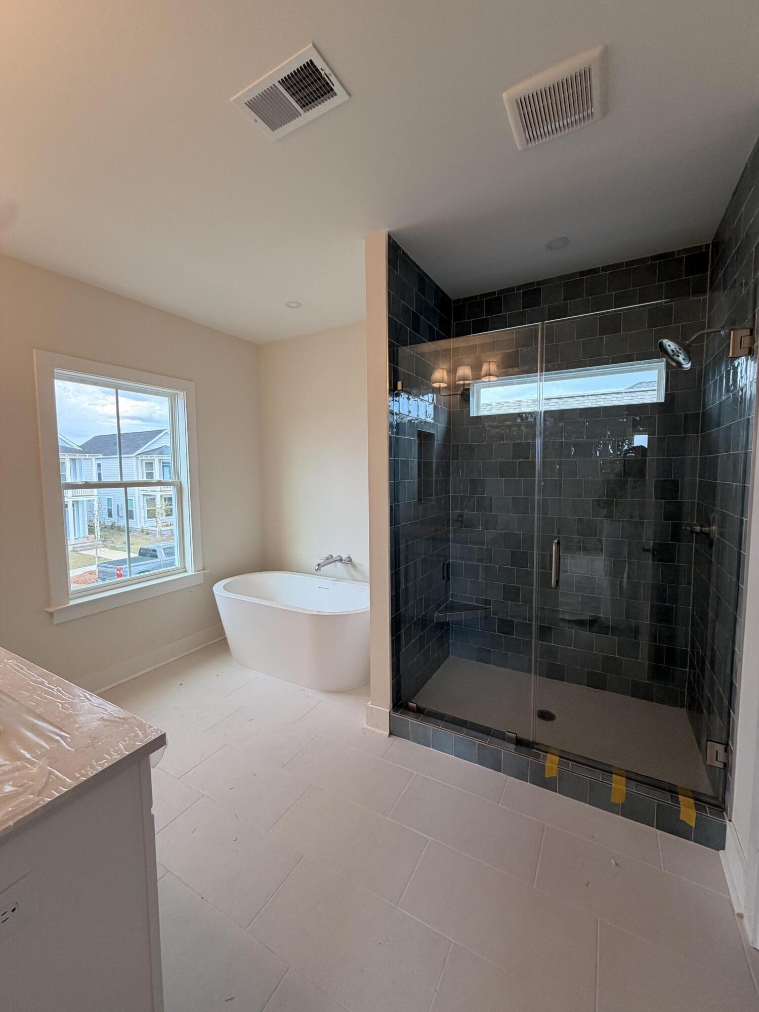 709 Rumbling Leaf Lane Summerville, SC 29486 - Photo 37 of 49 Large tiled shower with soaker tub