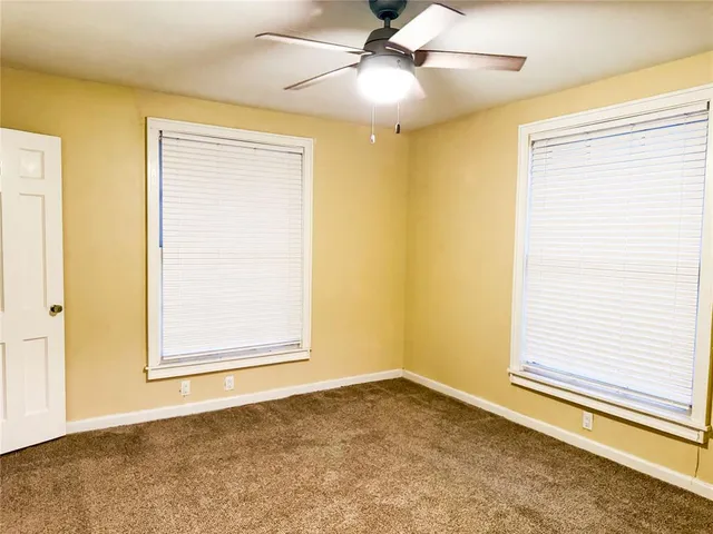 a view of an empty room and window