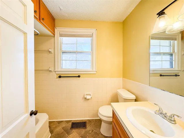 a bathroom with a sink and a toilet