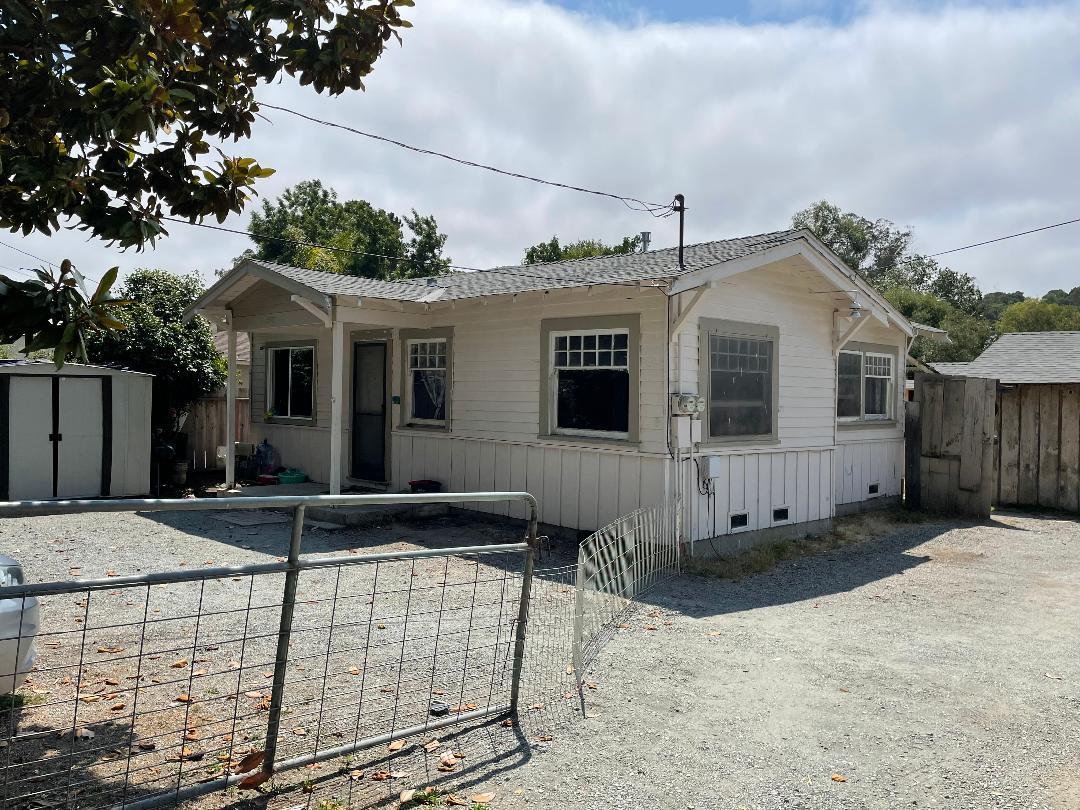 a front view of a house with garage