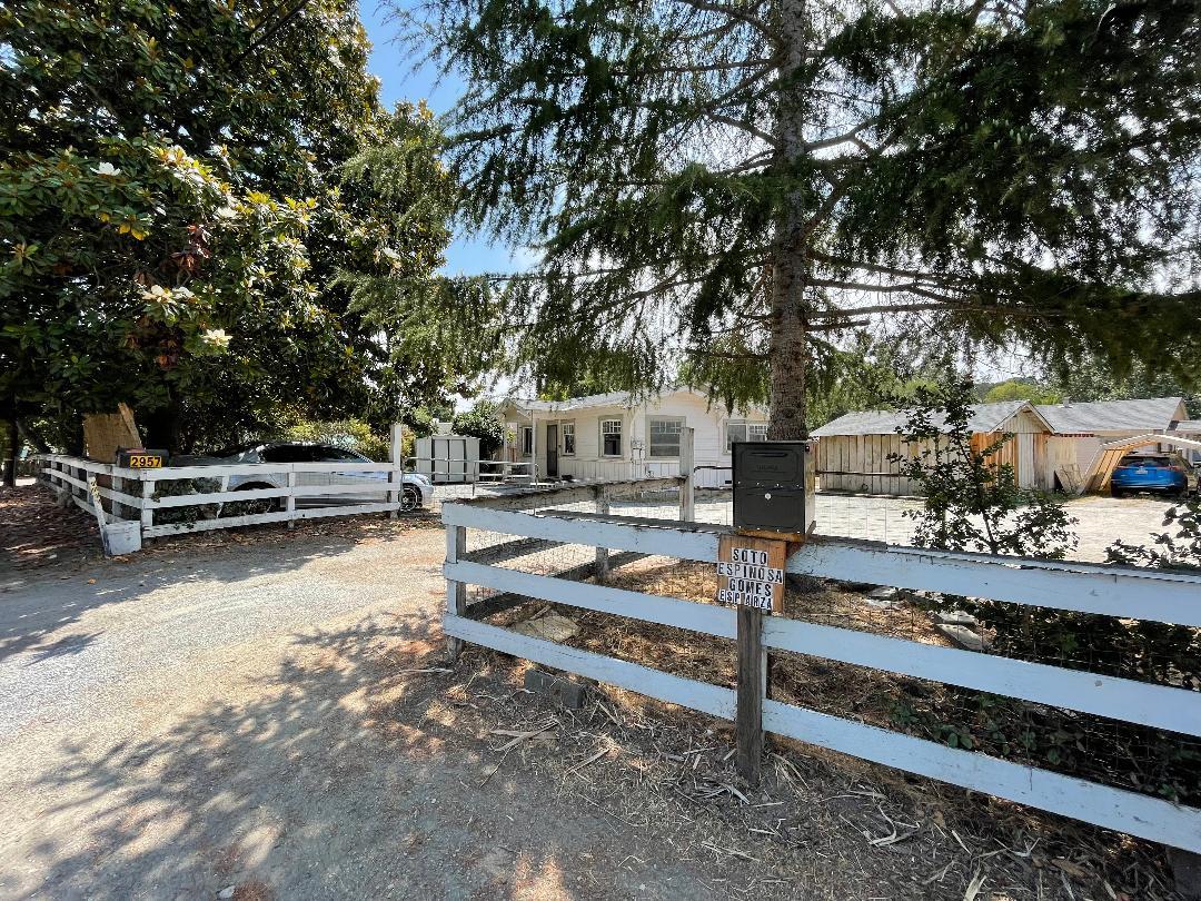 2957 Freedom Boulevard Watsonville, CA 95076 - Photo 9 of 11 a view of a patio with table and chairs a fire pit and large trees
