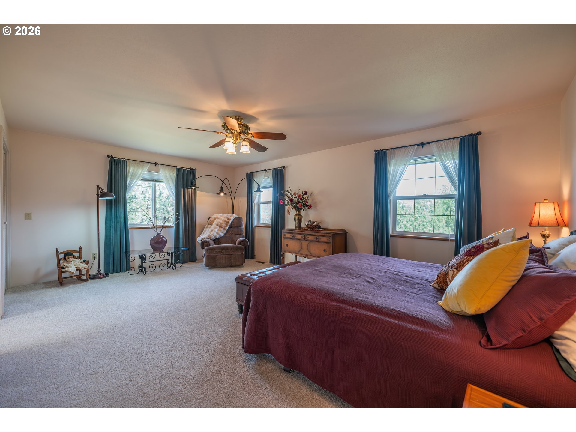 489 Fir Vista Road Sutherlin, OR 97479 - Photo 15 of 47 a bedroom with a bed and a chandelier