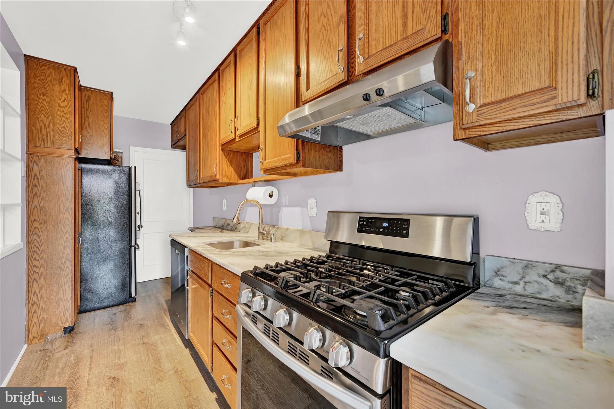 8356 Edgedale Road Parkville, MD 21234 - Photo 11 of 22 Galley kitchen is partially opened to dining room