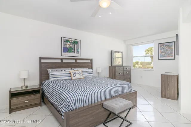 a bedroom with a bed and dresser