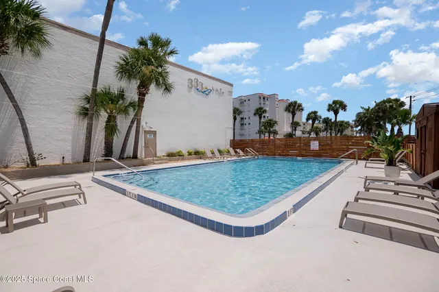 an outdoor space with lounge chair