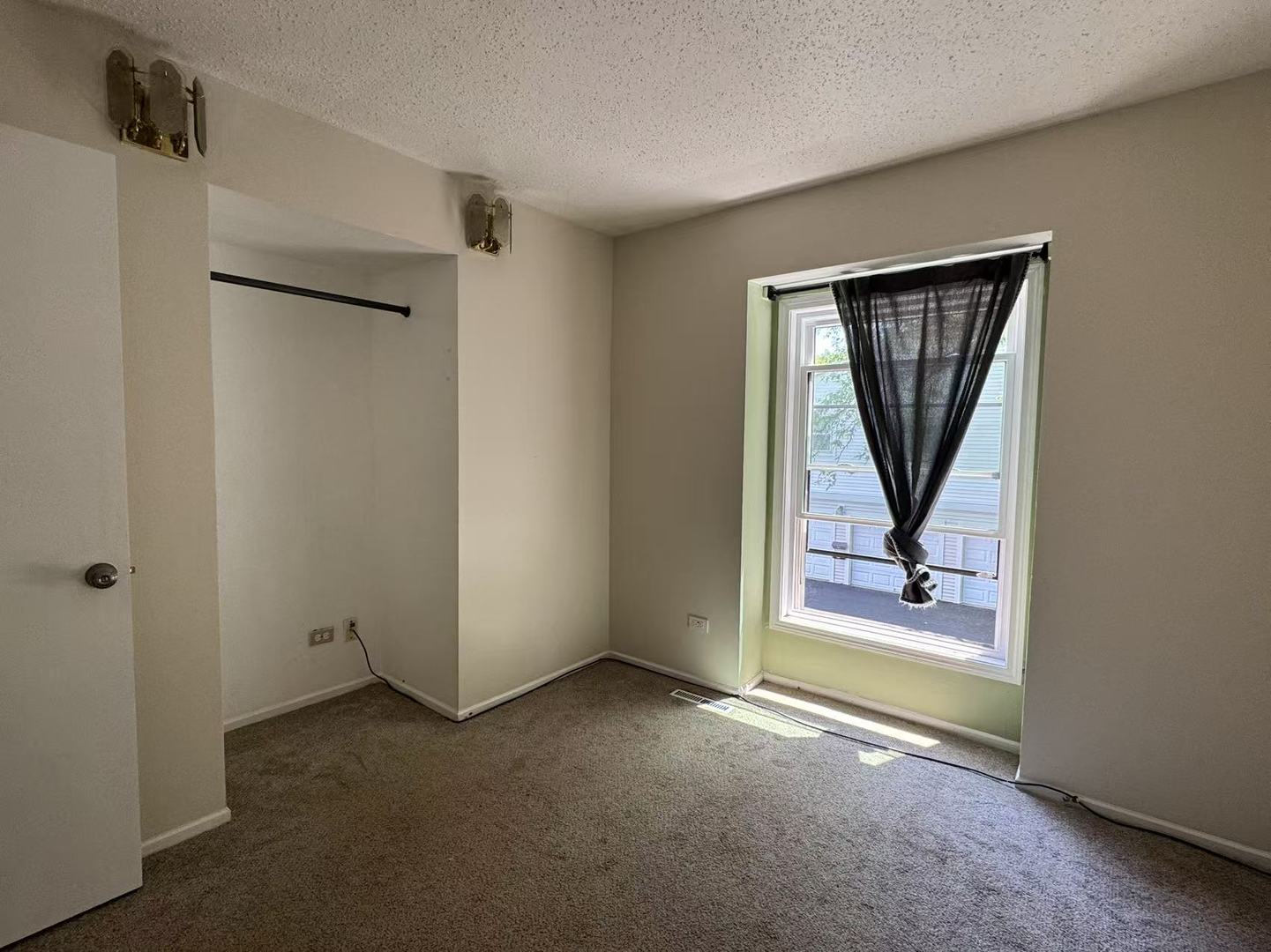 1326 Inverrary Lane, Unit 1326 Deerfield, IL 60015 - Photo 11 of 15 an empty room with windows and closet