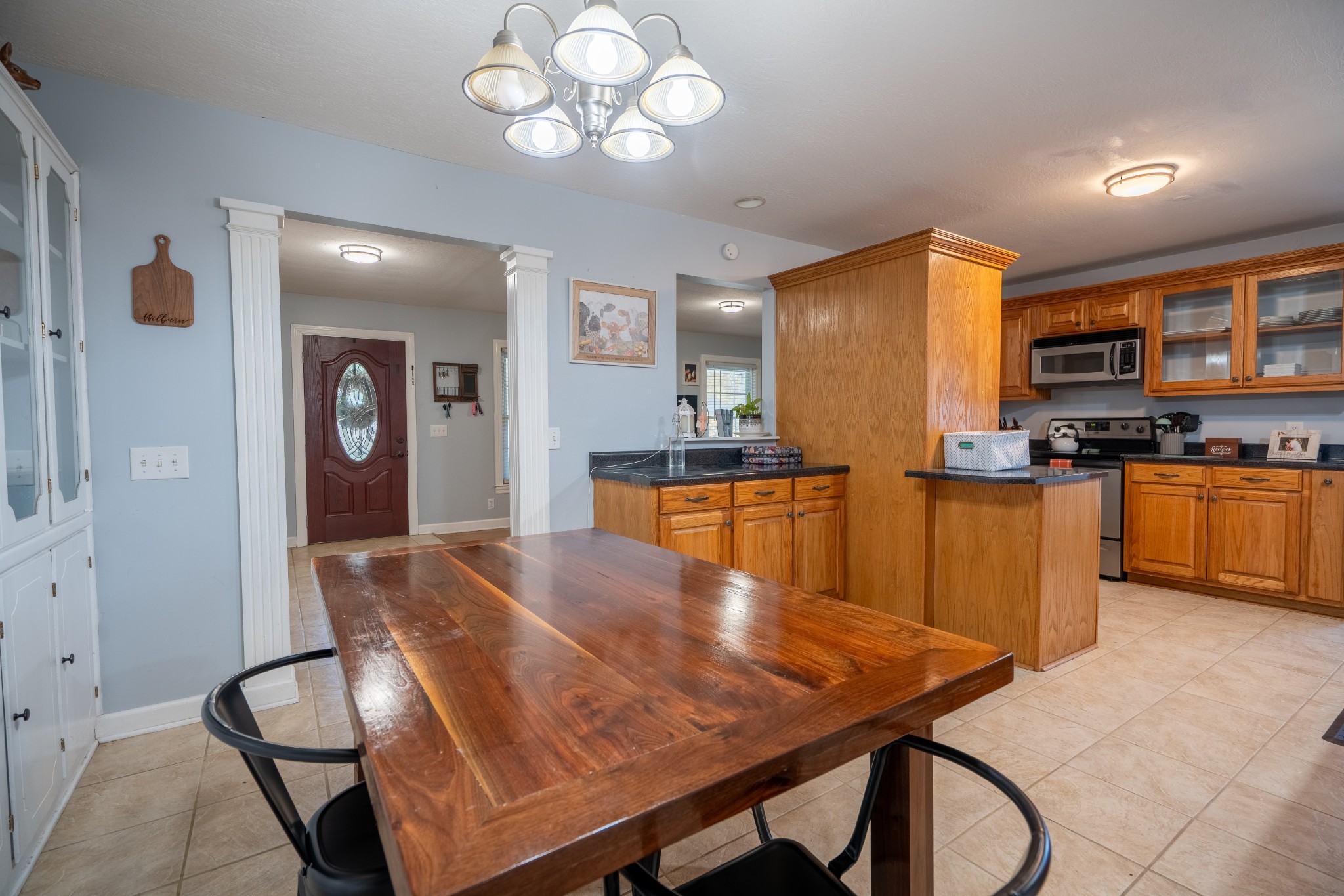 27 Tandy Road Leoma, TN 38468 - Photo 15 of 27 a kitchen with stainless steel appliances wooden floor dining table and chairs