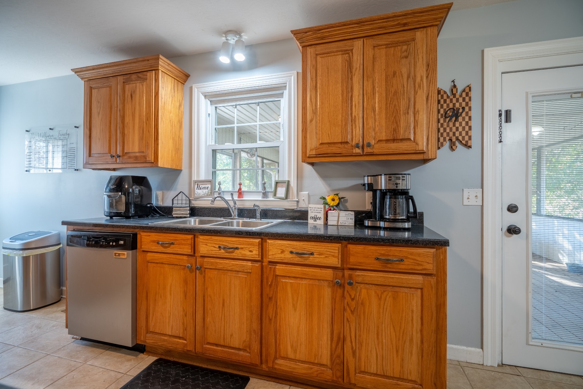 27 Tandy Road Leoma, TN 38468 - Photo 16 of 27 a kitchen with stainless steel appliances granite countertop wooden cabinets a sink and a window