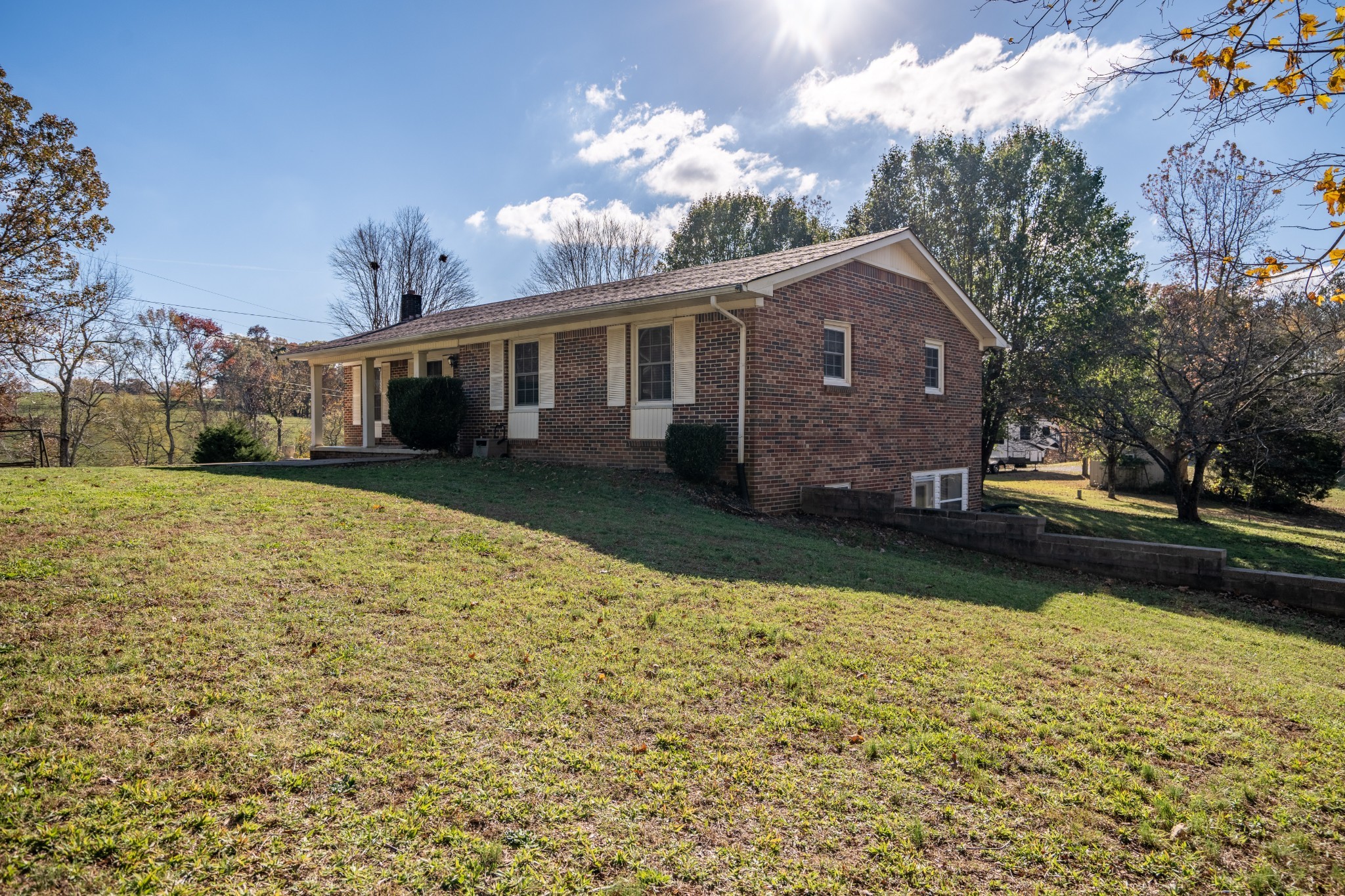 27 Tandy Road Leoma, TN 38468 - Photo 2 of 27 a front view of a house with a garden and trees