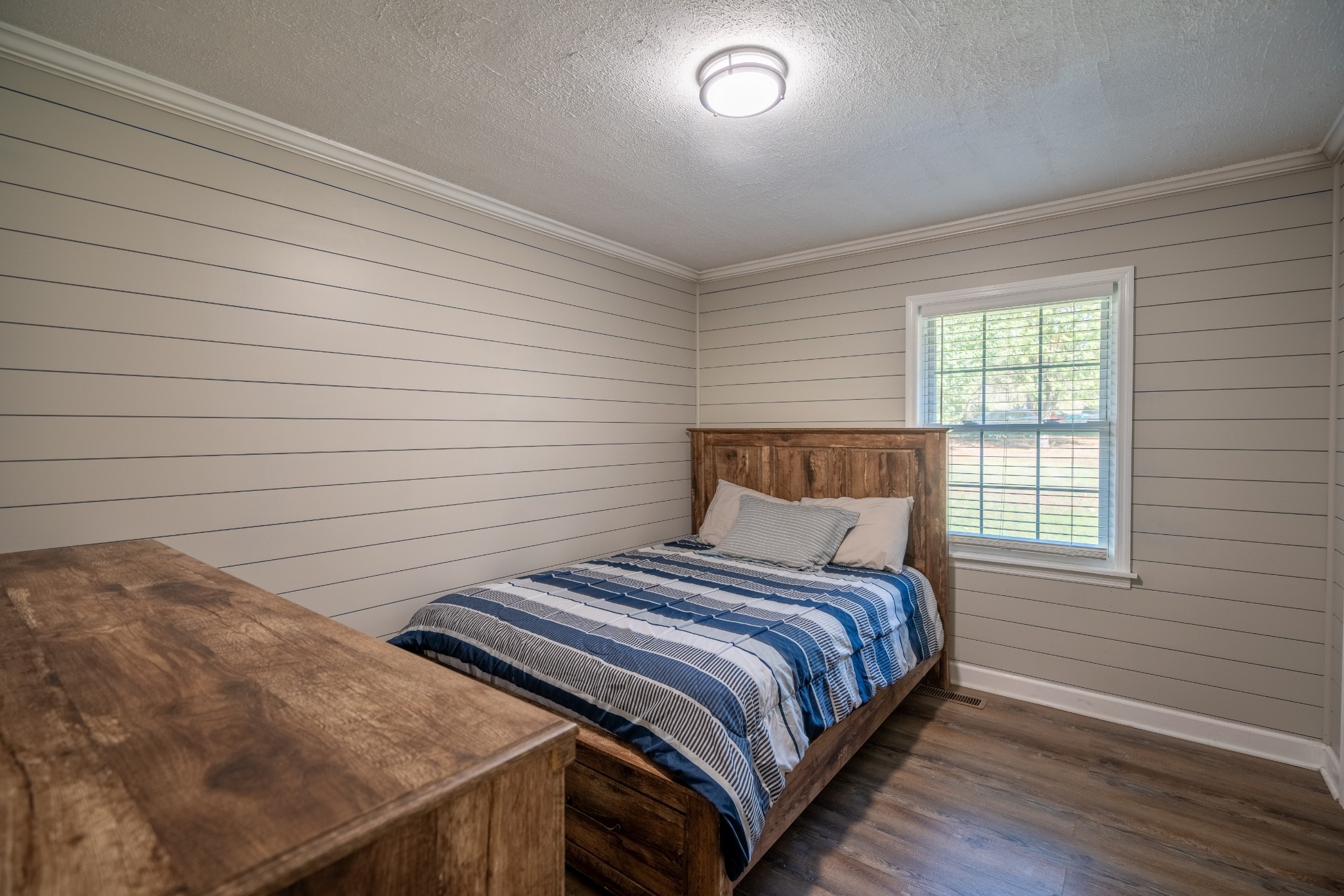 27 Tandy Road Leoma, TN 38468 - Photo 21 of 27 a bedroom with a bed and wooden floor