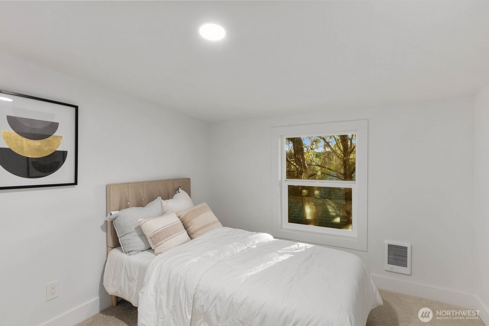512 Northwest 44th Street Seattle, WA 98107 - Photo 18 of 37 a bedroom with a bed and a window
