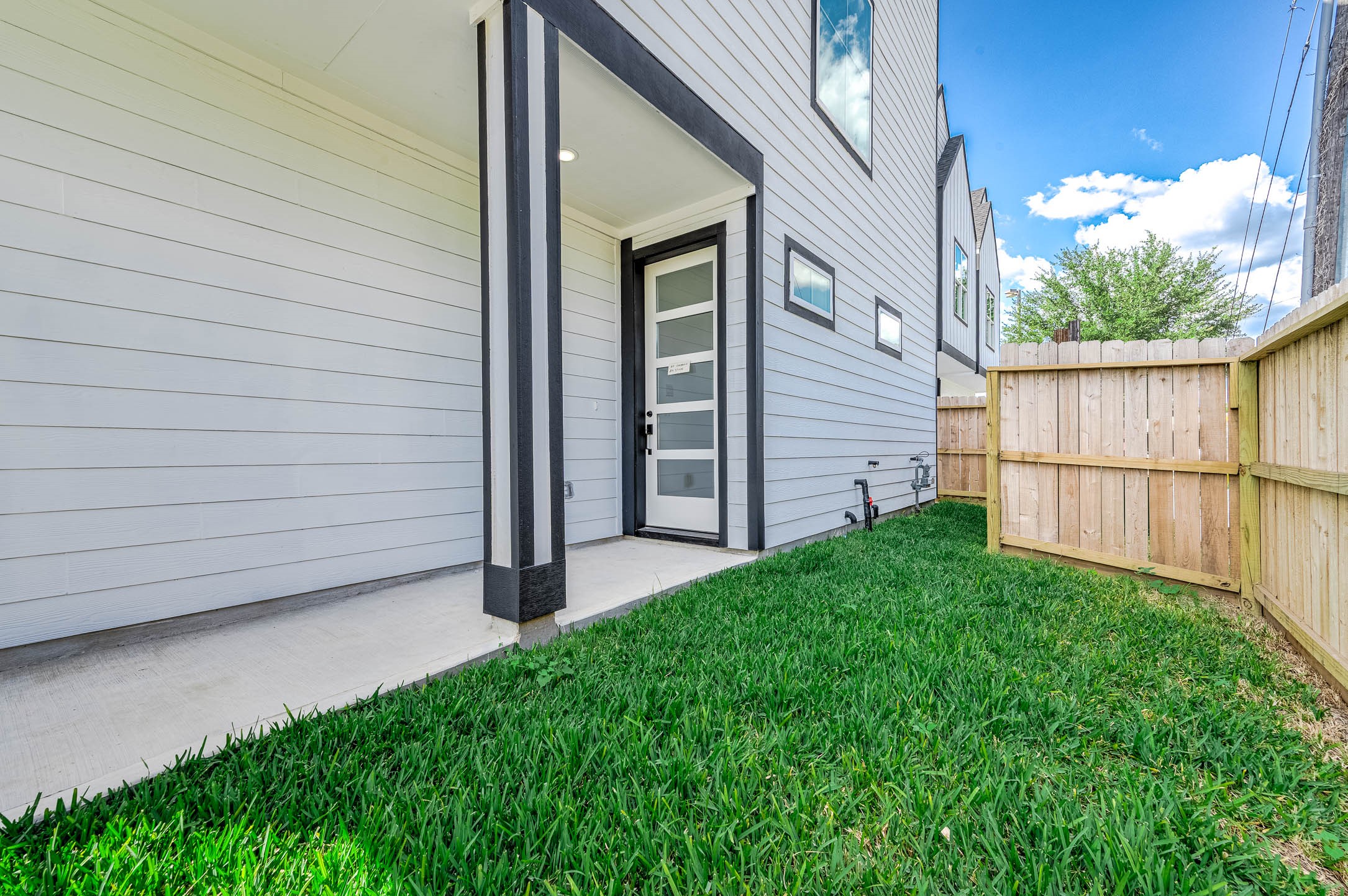 1515 Euel Street Houston, TX 77009 - Photo 5 of 34 Inviting private entryway framed by modern siding and a covered approach, creating a warm first impression for guests and residents alike.