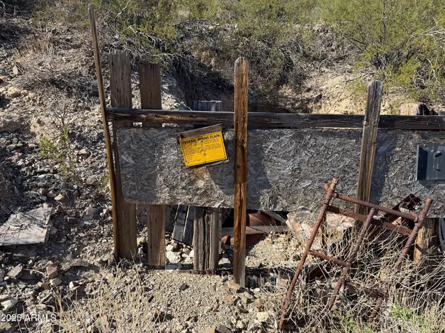 a backyard of a house with barbeque oven table and chairs