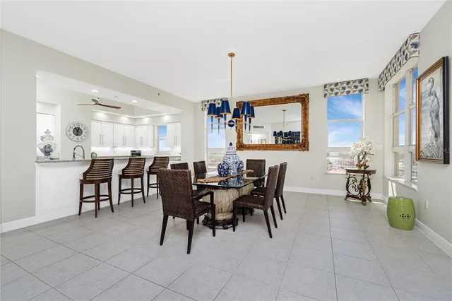 a kitchen with granite countertop white cabinets and sink
