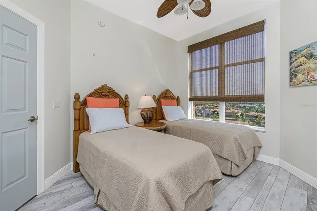 a view of a city from a balcony with furniture