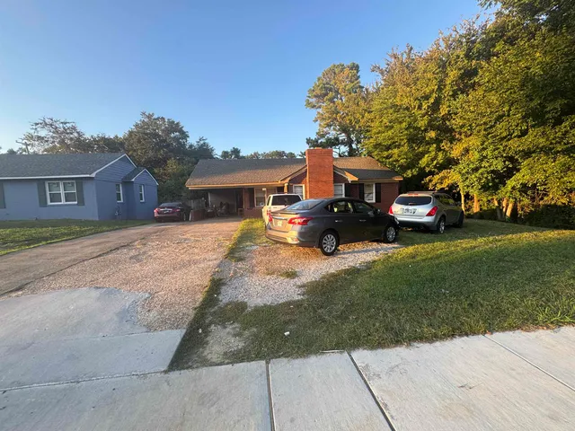 a car parked in front of a house