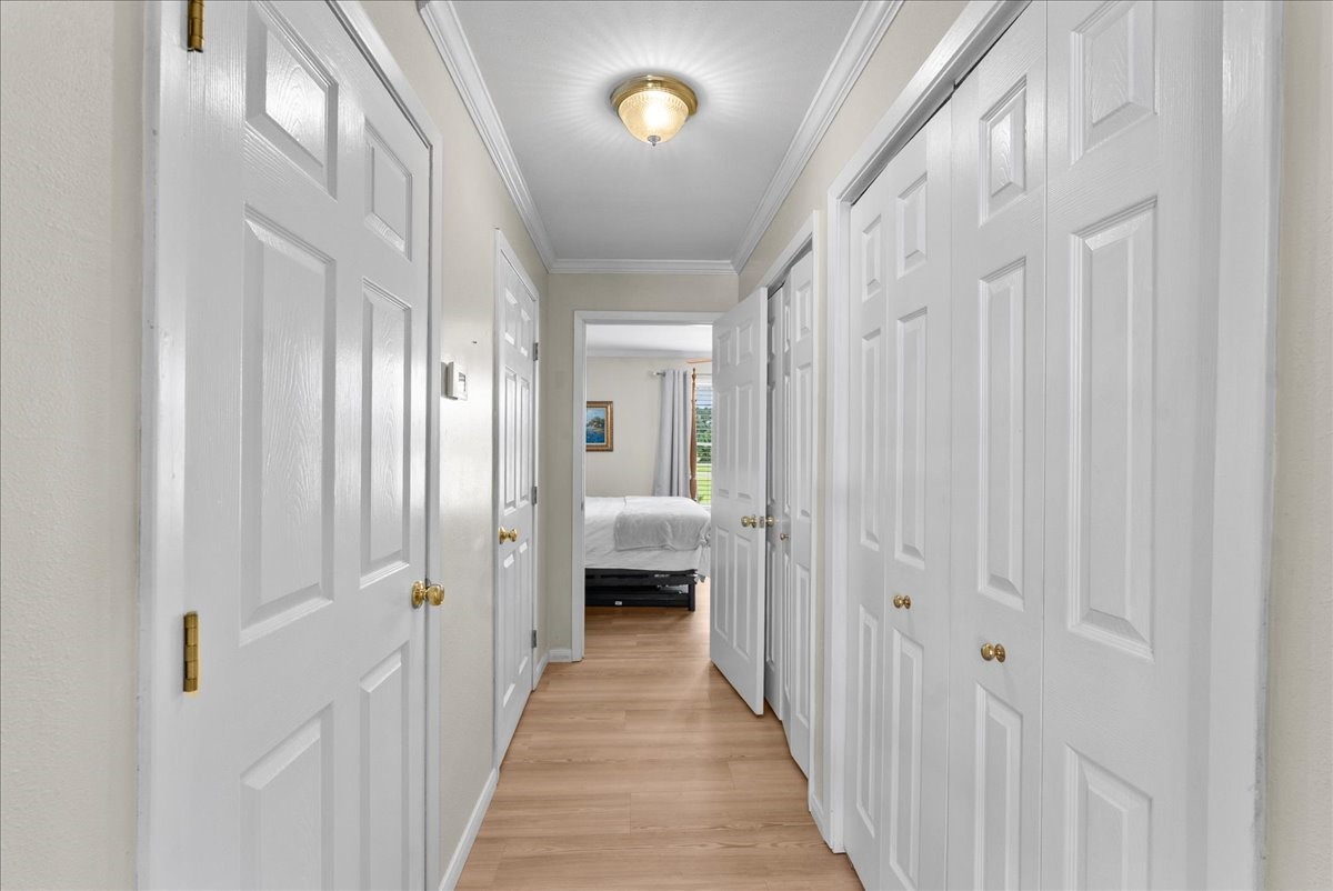 804 Otter Road Anahuac, TX 77514 - Photo 29 of 44 Hallway leading to the primary bedroom.