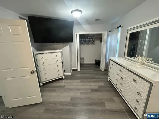 a view of bathroom with bathtub and mirror