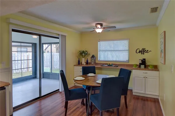 a view of a dining room with furniture window and wooden floor