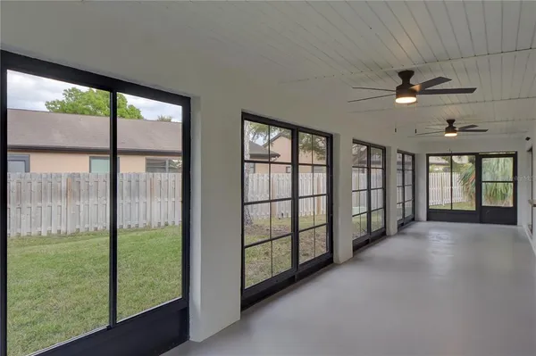 a view of a big room with windows