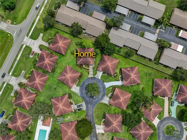 an aerial view of residential house with outdoor space and street view