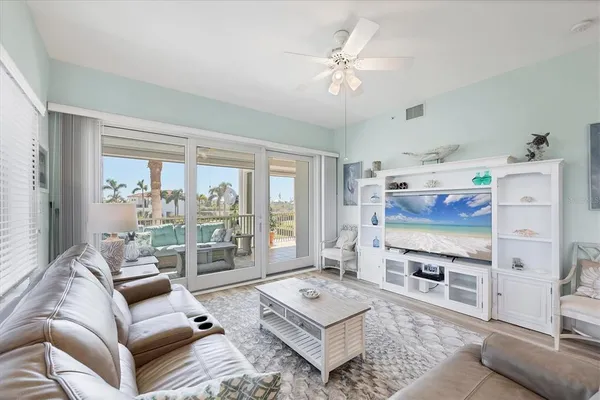 a kitchen with granite countertop a sink a counter space cabinets and stainless steel appliances