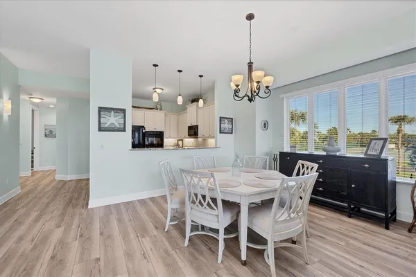 a bathroom with a double vanity sink mirror and bathtub